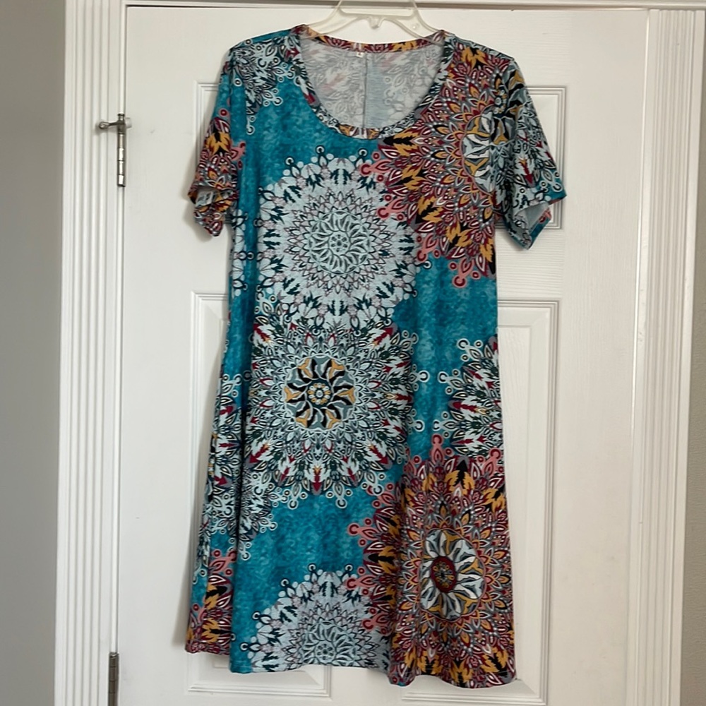 Super cute tunic or swim cover up. New without tags. Smoke and pet free home
